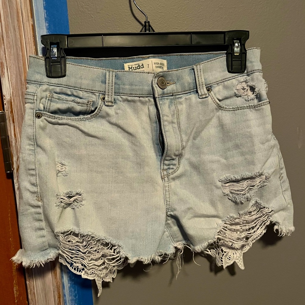 ripped jean shorts with lace under the pockets